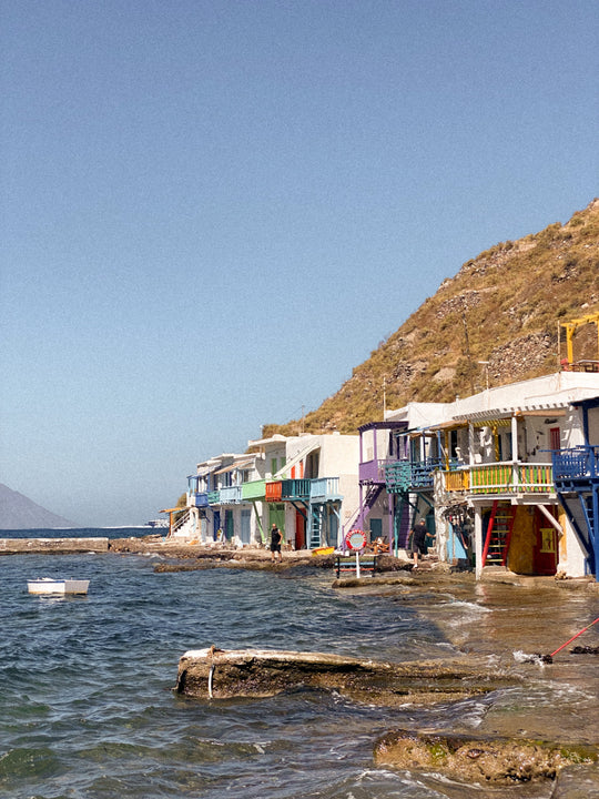 A cute seaside town on Milos called Klima. The colourful boathouses line the shoreline with the sea lapping at the doors