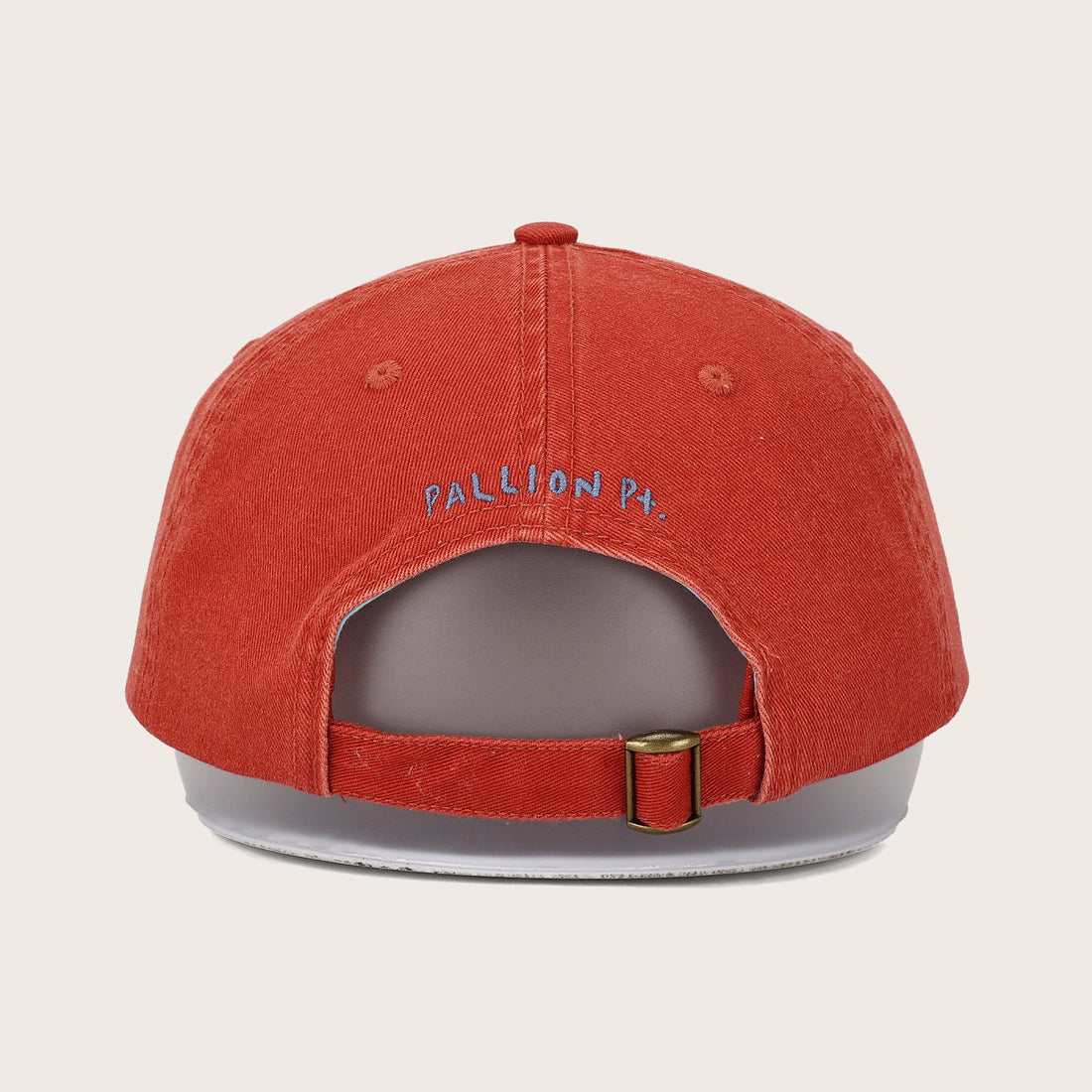 Pallion Point red sardine dad cap with Pallion Pt. embroidered in blue-grey on the back. 